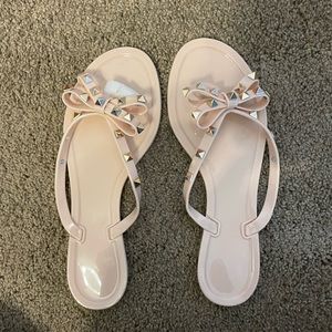 Nude womens jelly bow flip flop sandal
